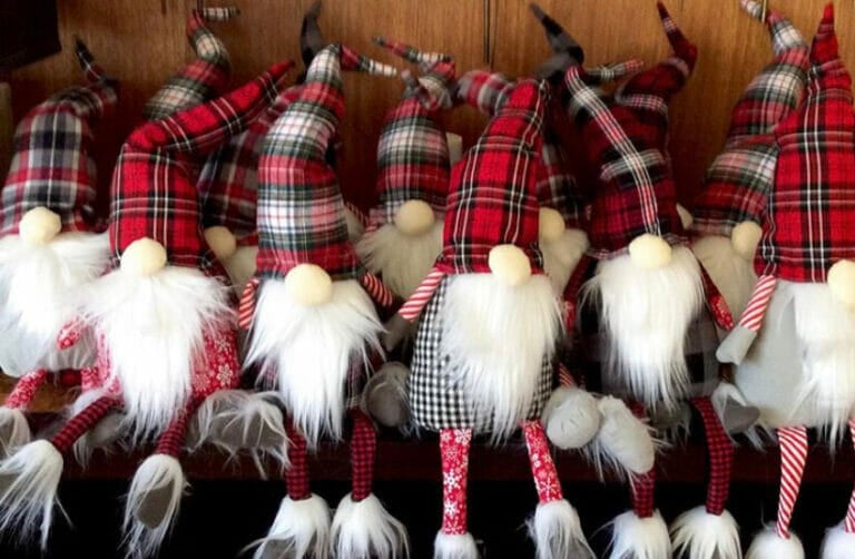 Row of festive gnome decorations.