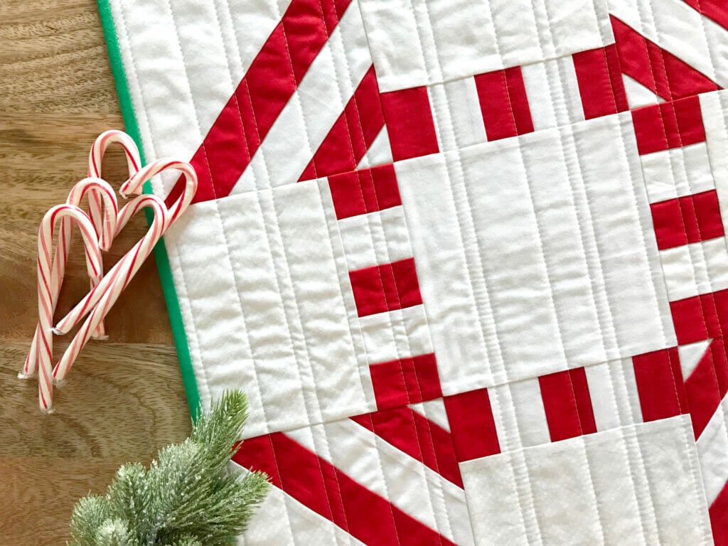 Red and white quilt with candy canes