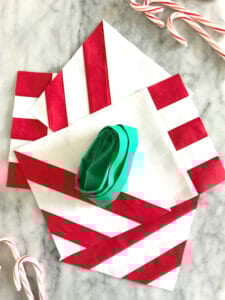 Red and white striped napkins, ribbon