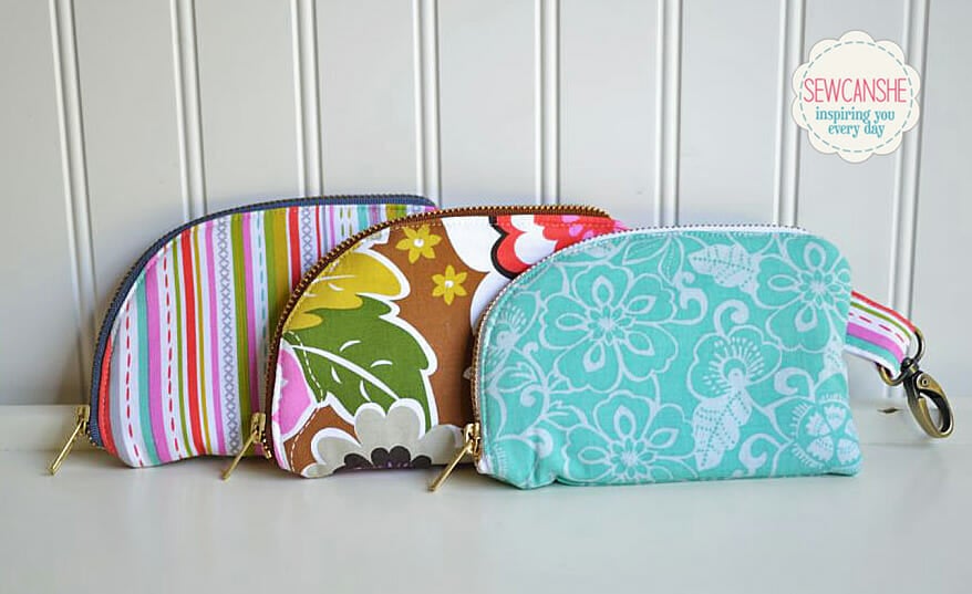 A handmade double-sided zipper pouch by SewCanShe, sized for a smartphone with an extra pocket for cards. A brilliant and free sewing pattern for a vibrant, organized wallet.
