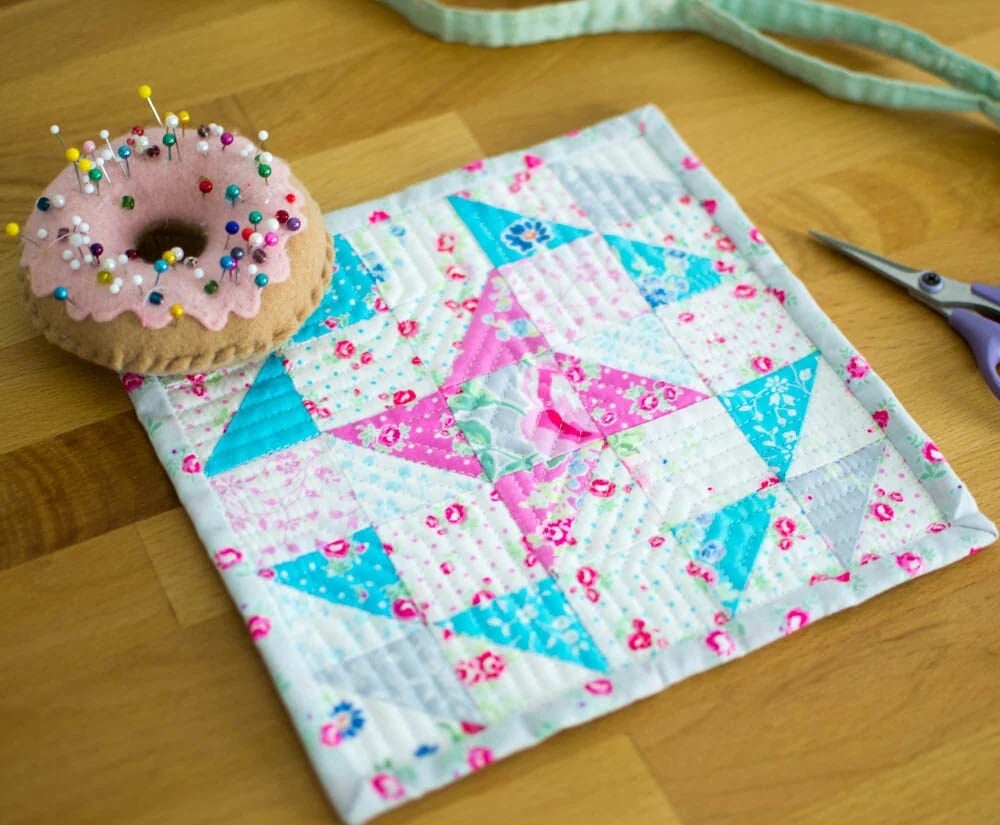 Colorful quilt with donut and scissors