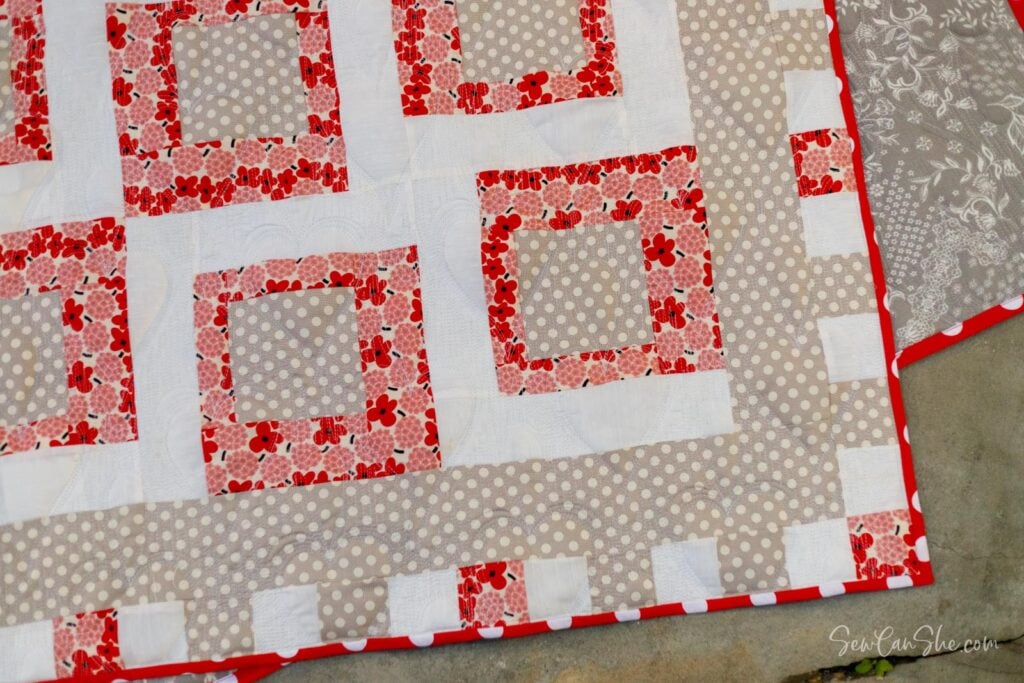 Colorful quilt with a geometric border, sewn from 3 yards of fabric.