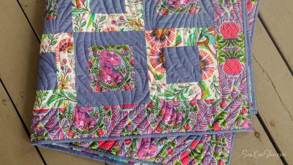 Colorful quilt with geometric design made with 3 yards of fabric.