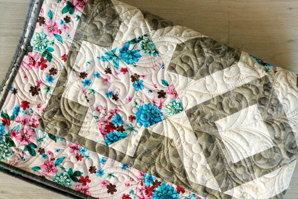 colorful quilt with diamond designs sewn with 3 yards of fabric