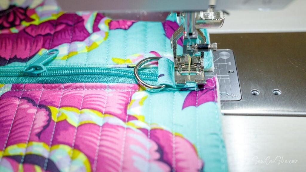 Sewing machine stitching colorful fabric