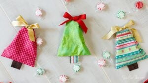 three hand sewn gift bags in the shape of Christmas trees