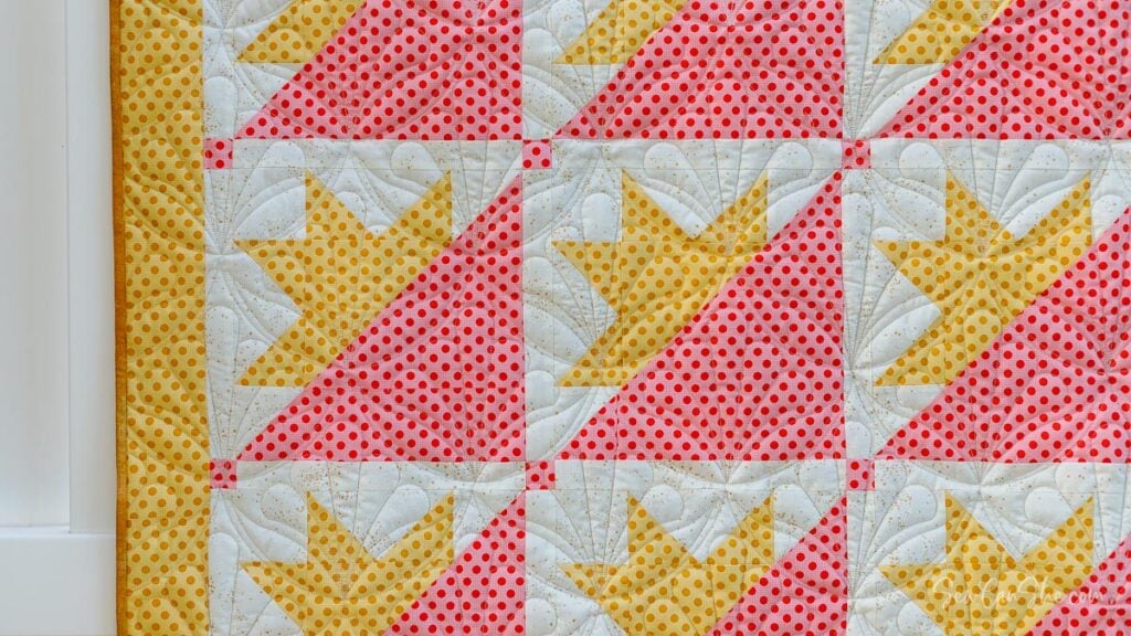 Colorful quilt with half star blocks