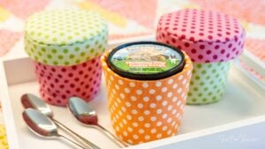 Colorful ice cream containers with spoons