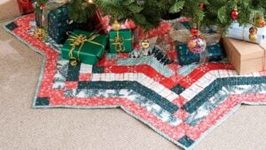Christmas tree skirt sewn with fabric strips in the shape of a star