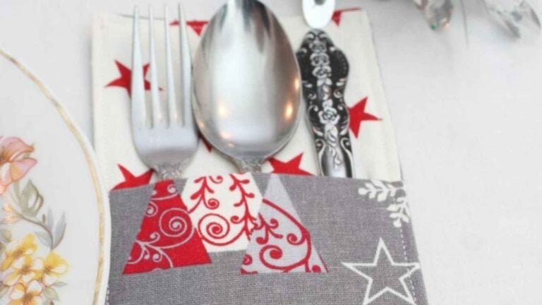 cutlery in a hand sewn fabric holder for Christmas table setting