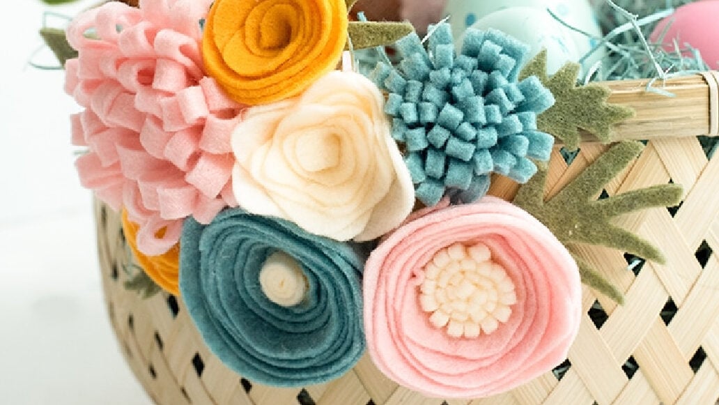Embellished Wicker Basket: A classic wicker Easter basket decorated with colorful, handmade felt flowers.