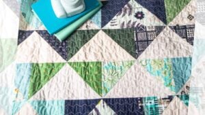 colorful flying geese lap quilt