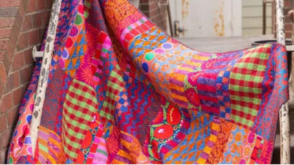 Colorful patterned fabric draped outdoors.