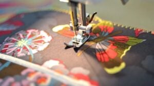 Sewing machine making a paper and fabric journal with ribbon