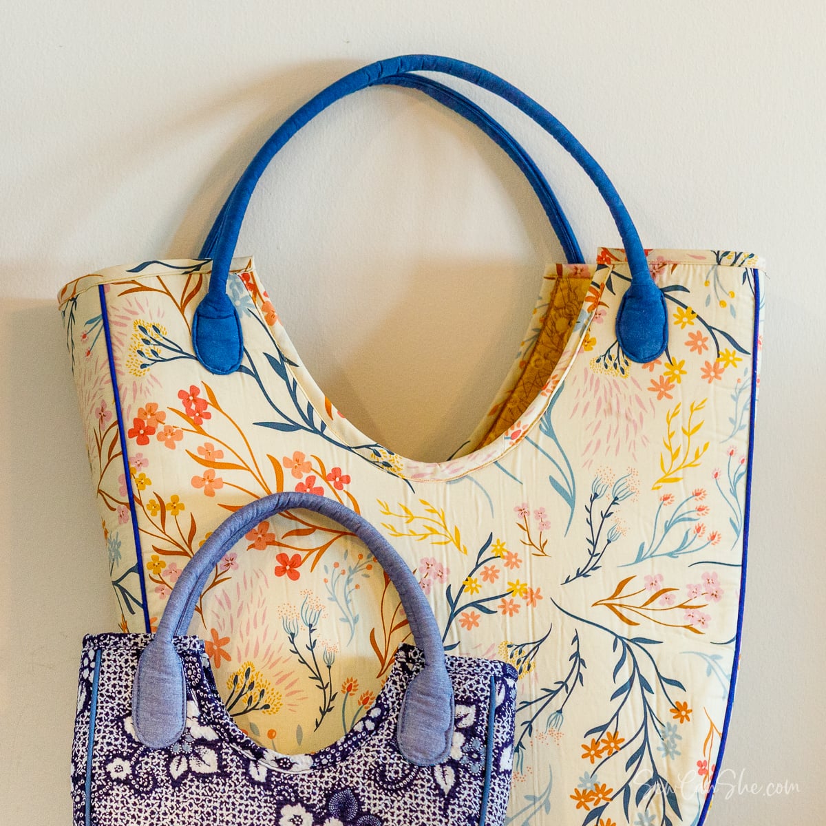 Two floral-patterned bags hanging decoratively