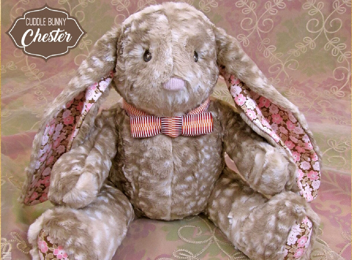 Handmade stuffed fabric bunny doll with floppy ears and a soft cotton finish, a professional-style bunny sewing pattern.