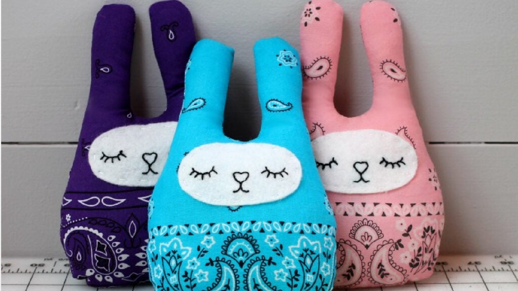 Three colorful stuffed bunny toys