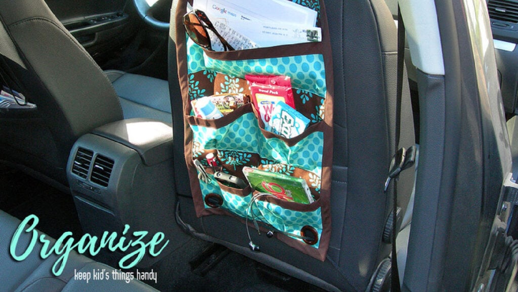 DIY car organizer that hangs from the front seat. It's perfect for backseat mission control.