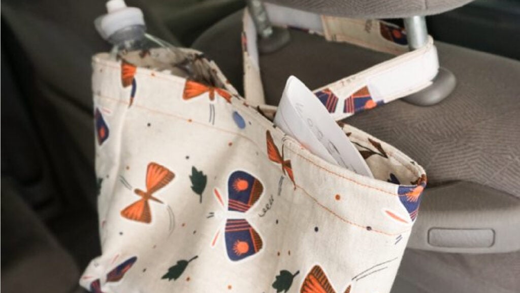 Hanging bag for holding loose items in your car while keeping them organized.