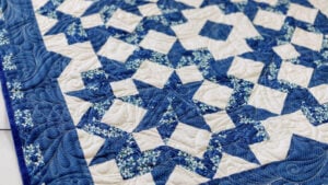 Blue and white 3 yard quilt with the carpenter star design