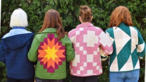 Four women in patterned quilted coats