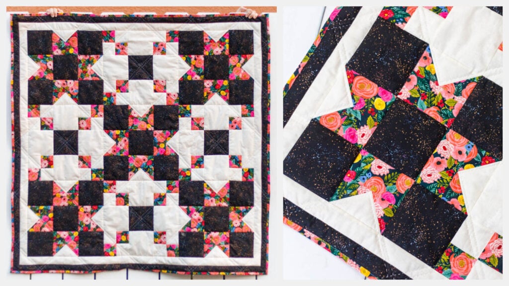 Colorful black, pink, and white star quilt with floral patterns