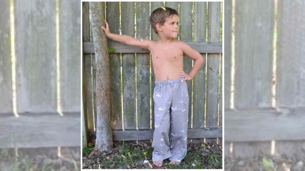 a young boy modeling simple pajama pants