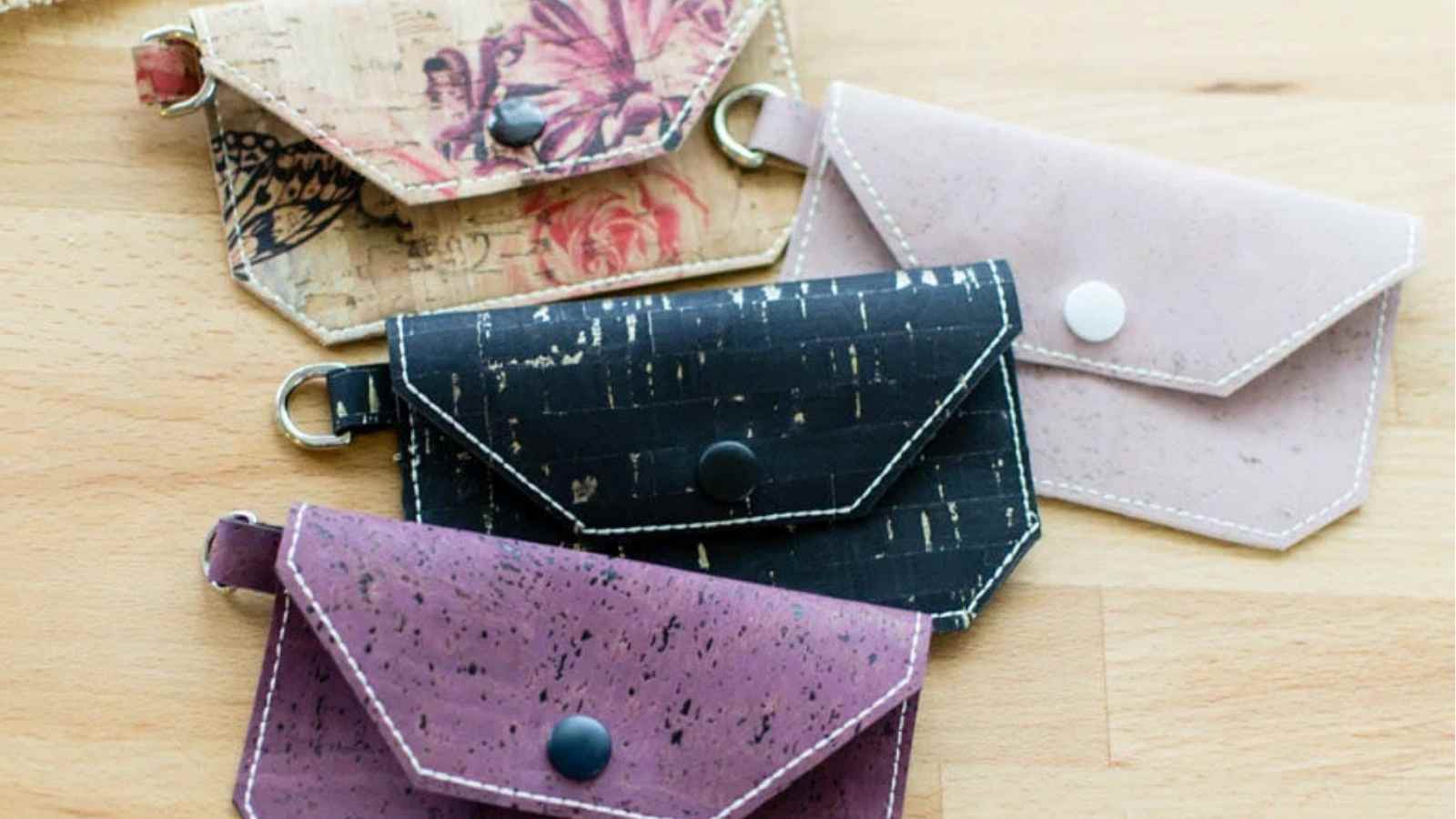 four handsewn wallets made from cork fabric