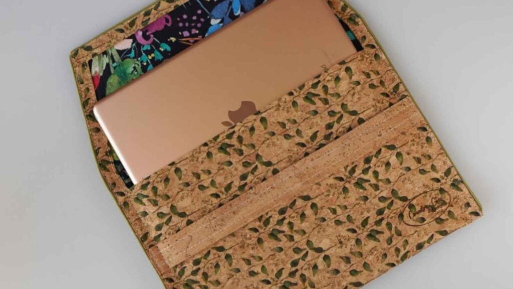 An iPad in a handmade sleeve for travel and tech protection. The sleeve is sewn in an envelope style for a modern and convenient feel.
