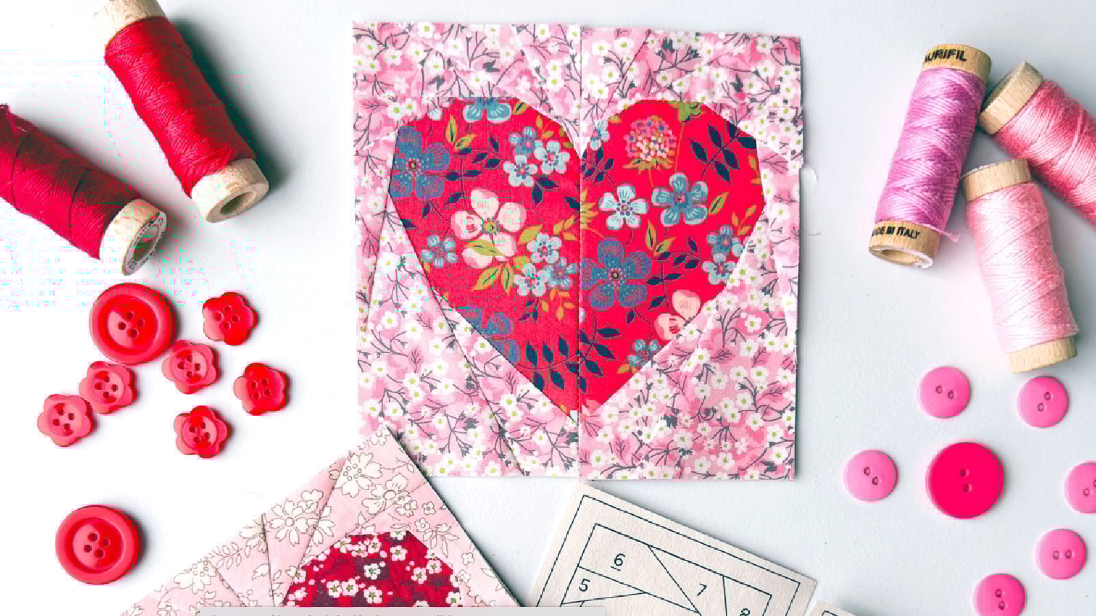 Colorful heart patchwork with sewing supplies