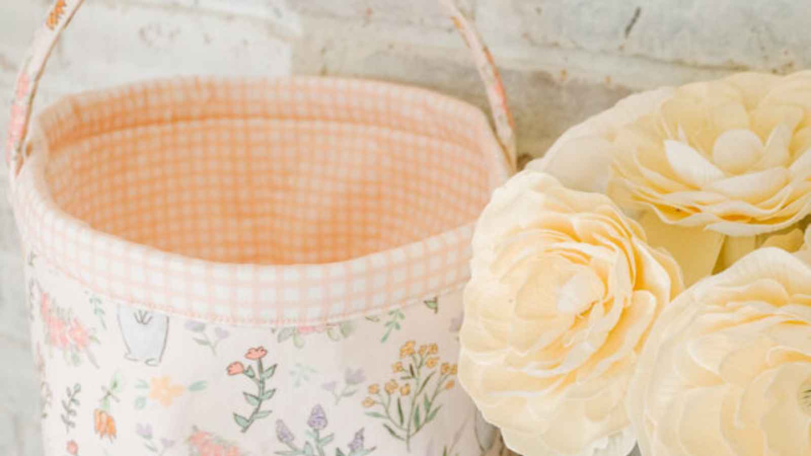 Beautiful handsewn easter baskets with peach flowers and pastel fabric.