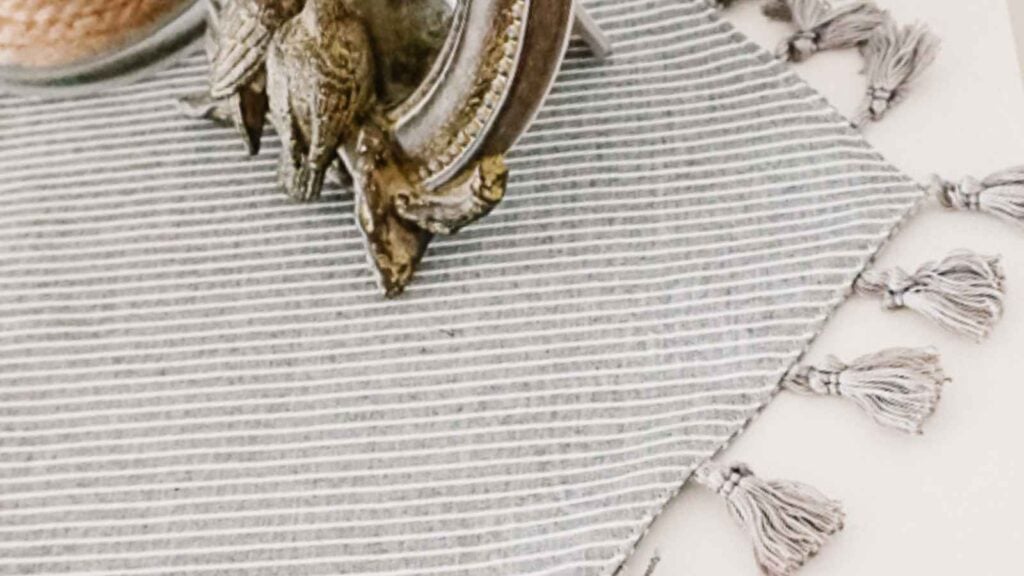 Striped table runner with decorative tassels