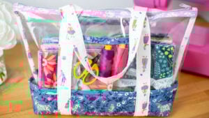 See through tote bag filled with supplies made with quilting cotton and clear vinyl fabric