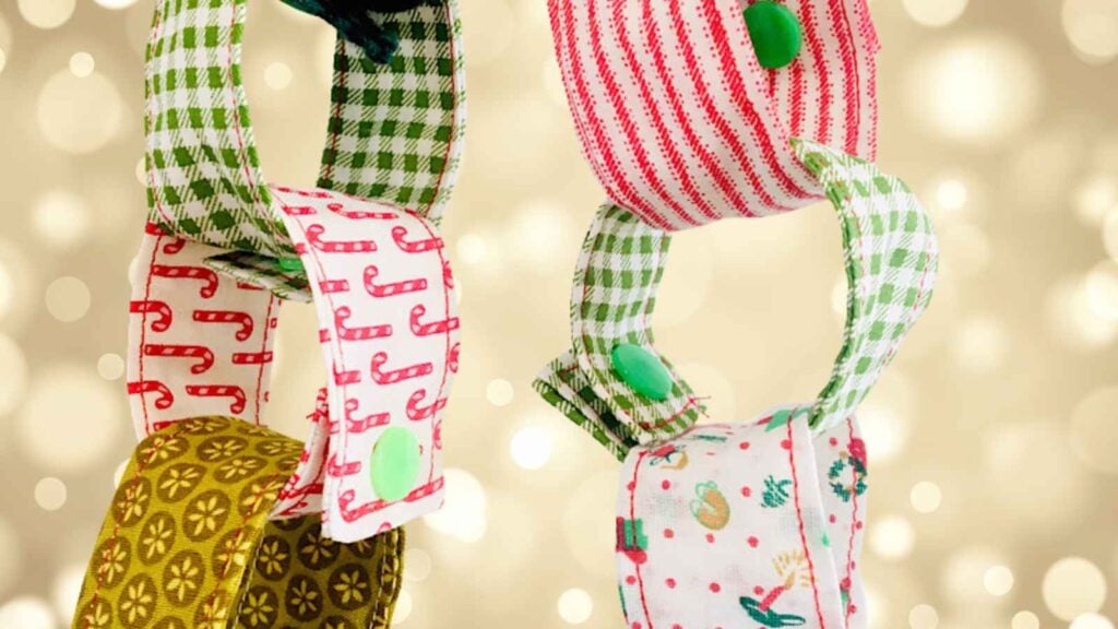 Festive reusable countdown chain sewn with scraps of Christmas fabric