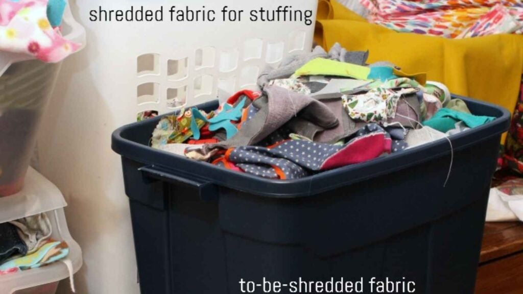 plastic bin filled with scraps of fabric