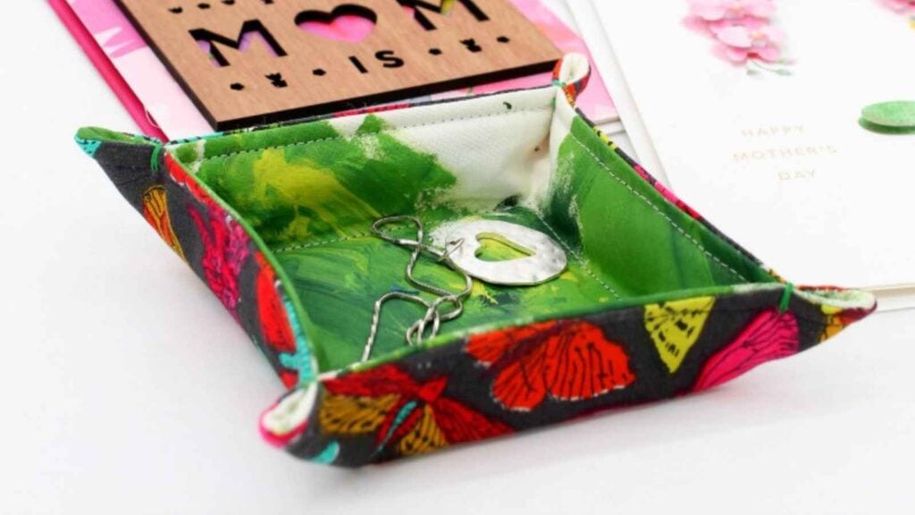 colorful hand sewn fabric tray with earrings in it