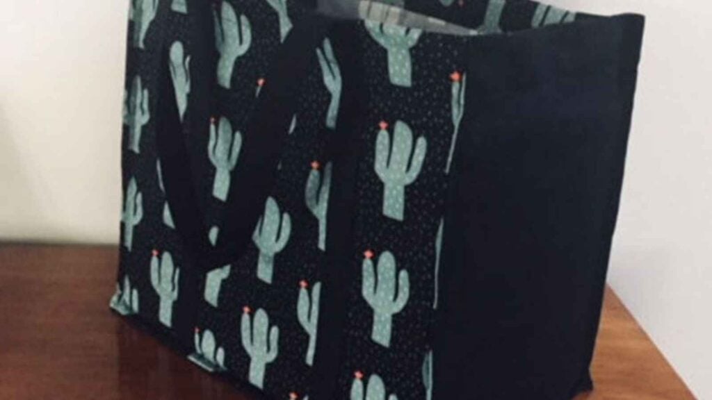 Cactus-patterned tote bag on table