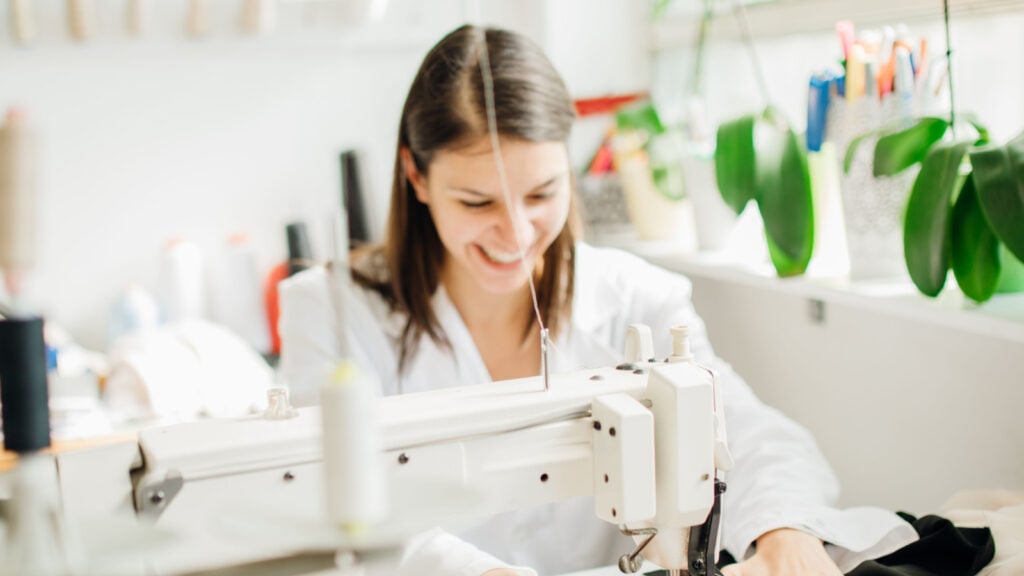 happy sewist woman quilting