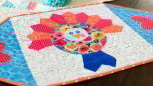 Colorful turkey-themed table runner design.