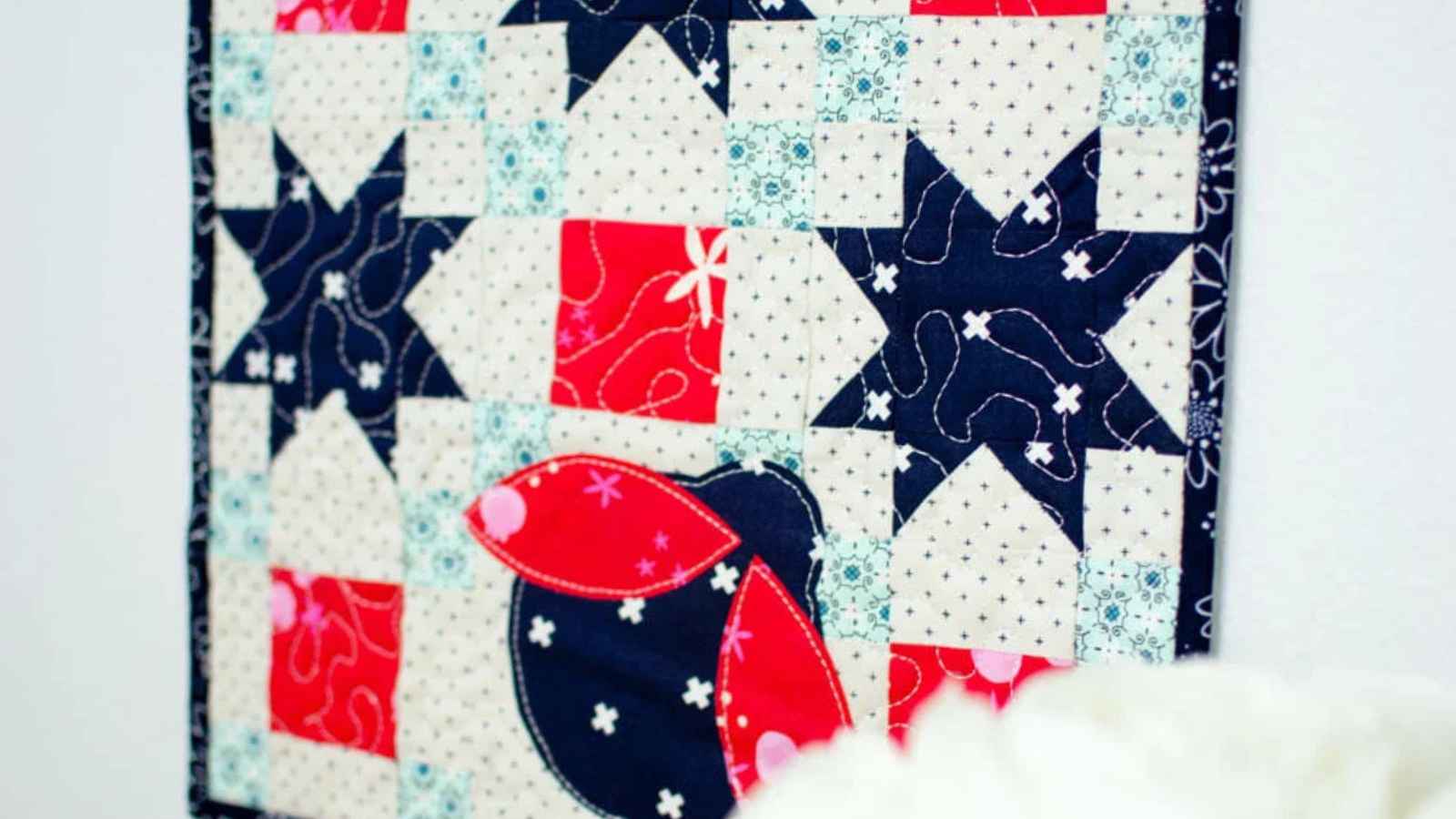 patriotic mini quilt with a ladybug