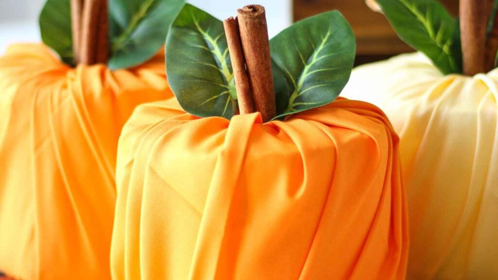 Colorful fabric pumpkins with cinnamon sticks