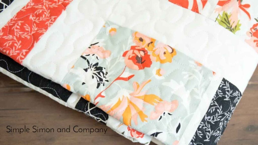 Colorful floral quilt with white background