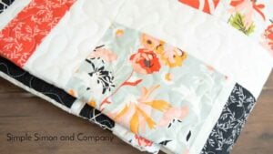 Colorful floral quilt with white background