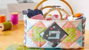 Colorful basket with sewing supplies inside.