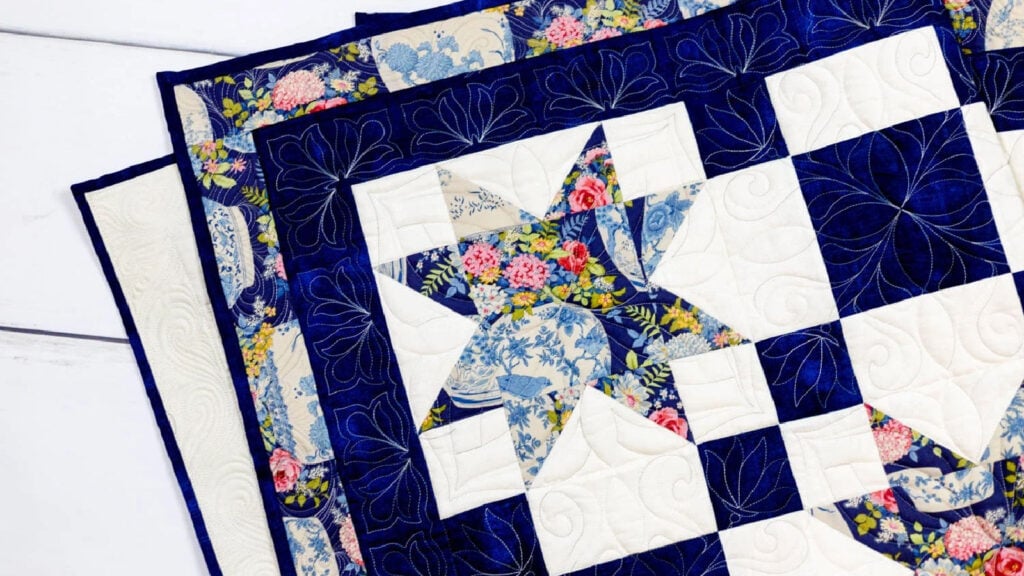 Striking quilt design with stars and irish chain blocks.
