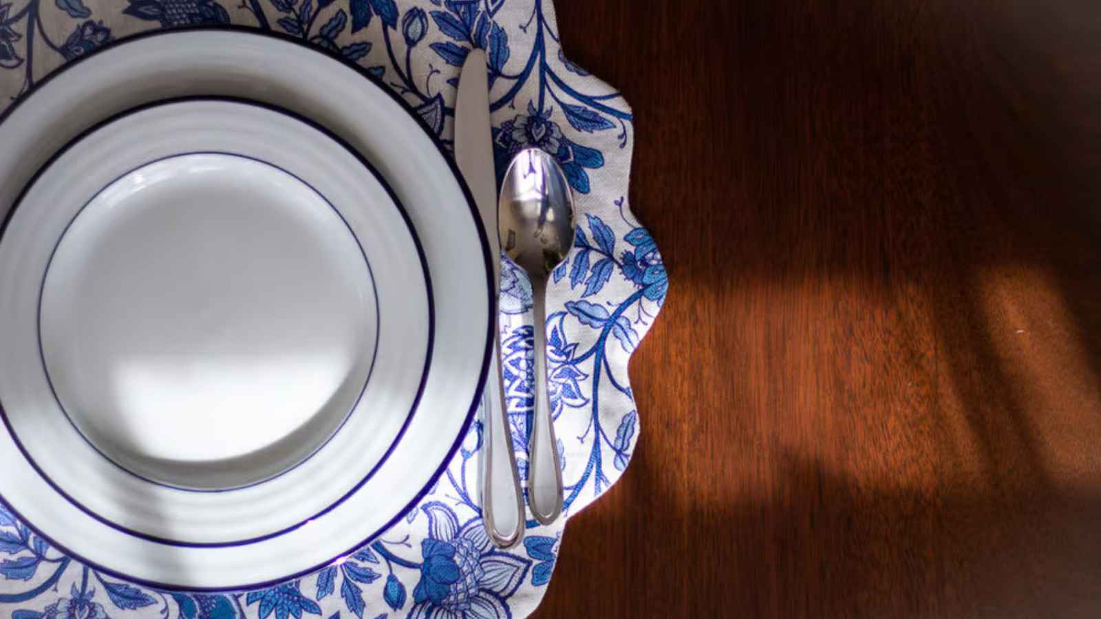 Elegant table setting with handmade floral placemat