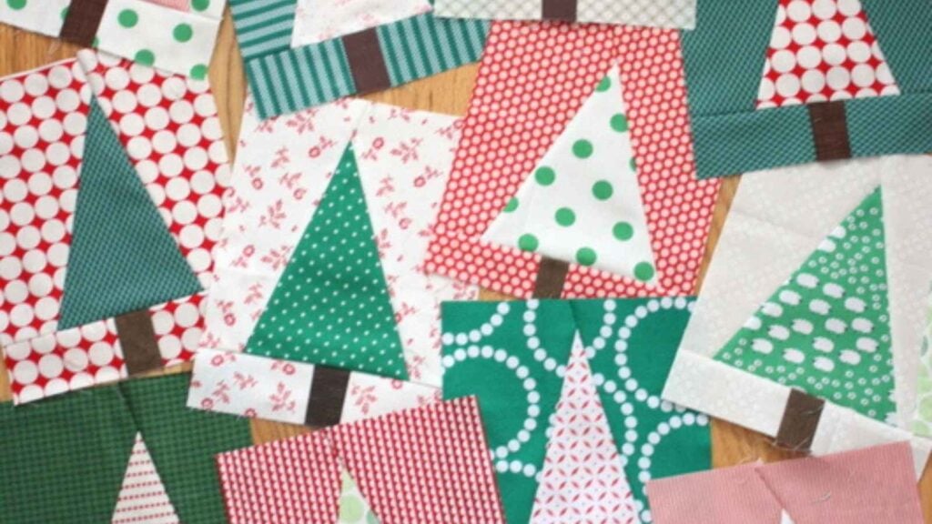 Pile of assorted scrappy tree quilt blocks