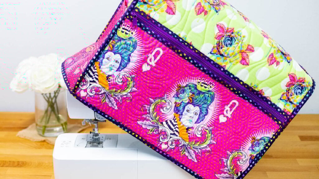 sewing machine with a colorful quilted cover.