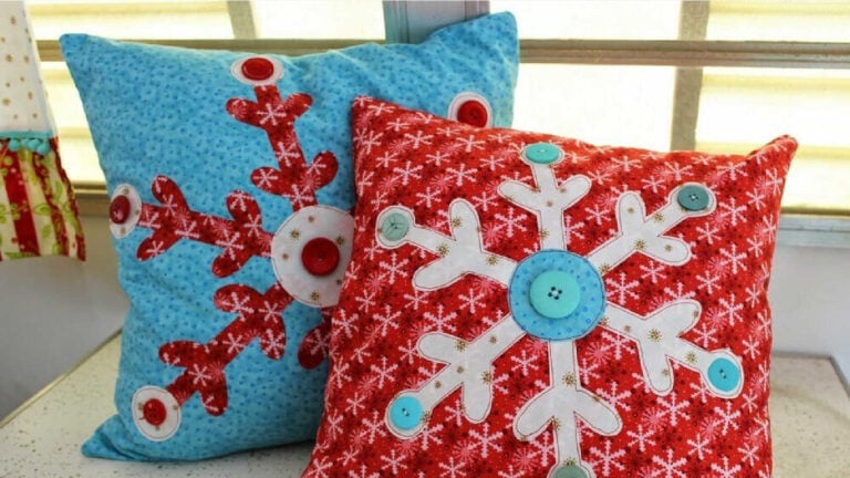 Two throw pillows with snowflake applique