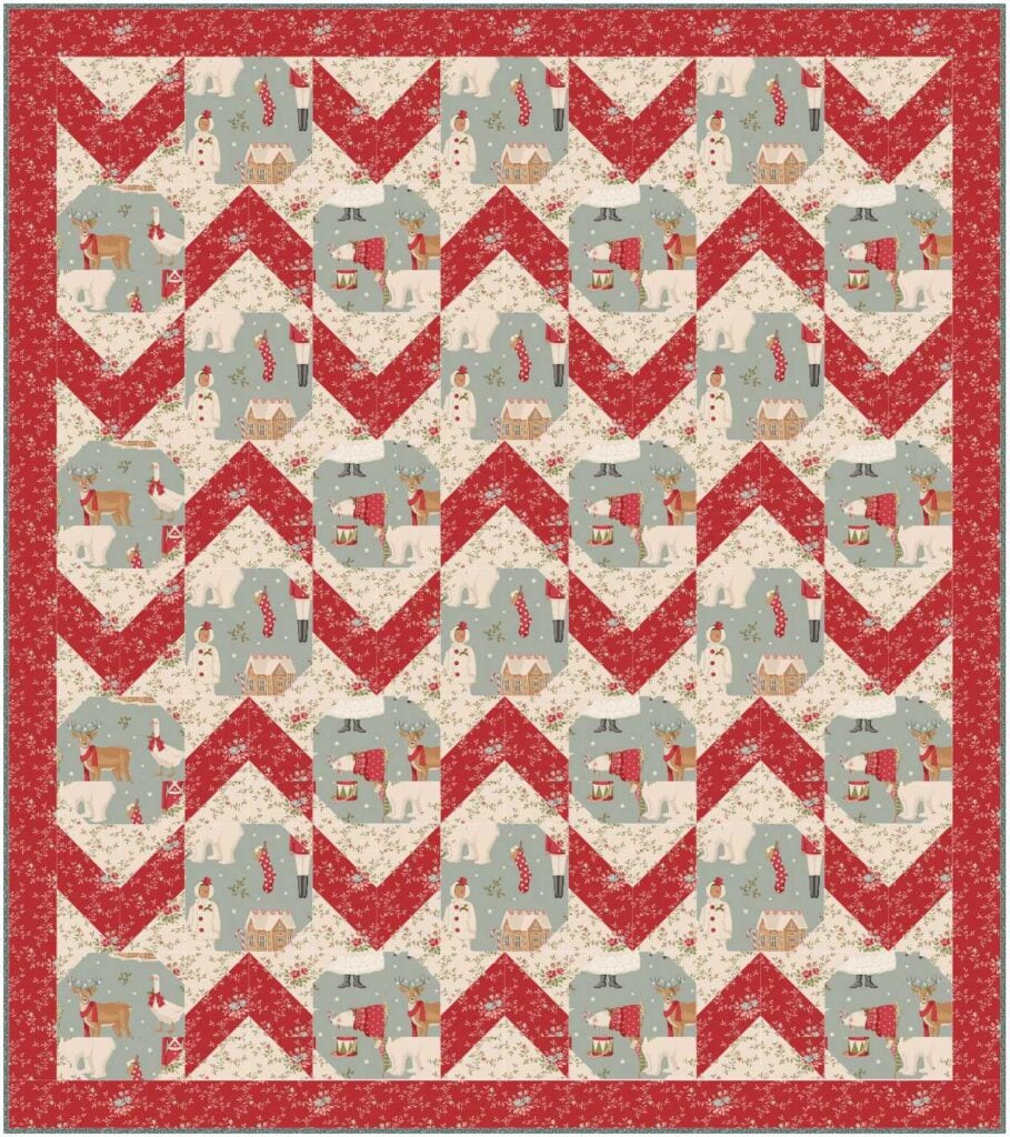 Festive quilt with red and gray patterns.